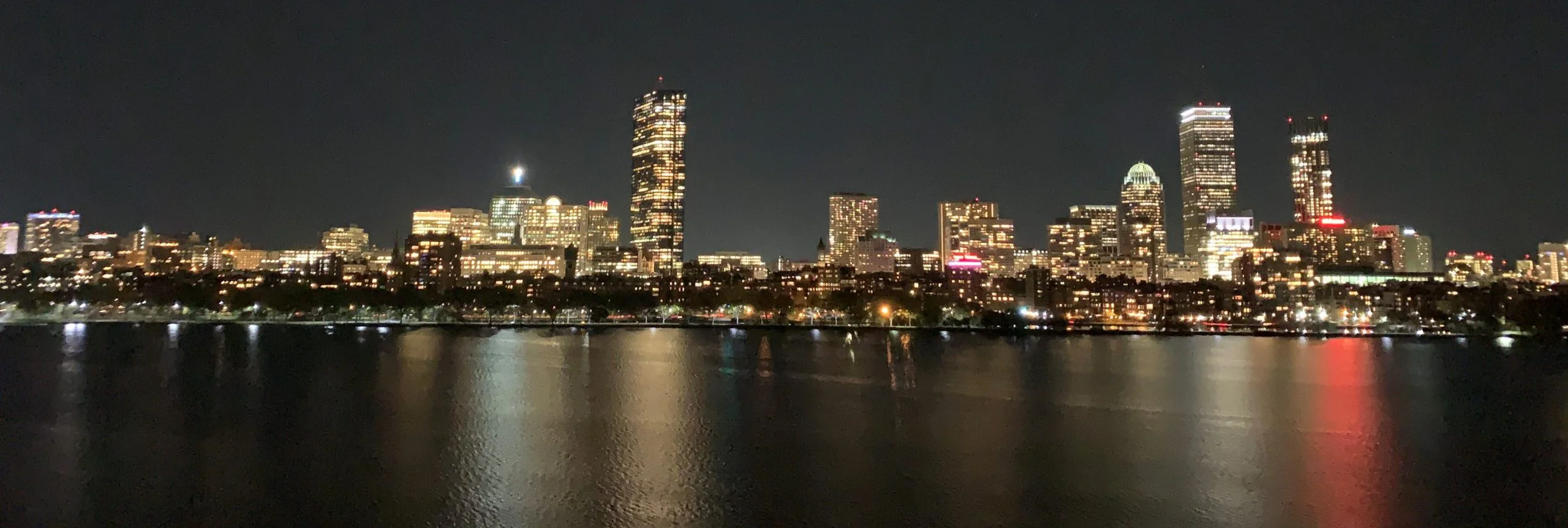 Boston by night, city panorama across the Charles River